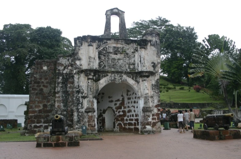 a gate with some broken arches in the stone