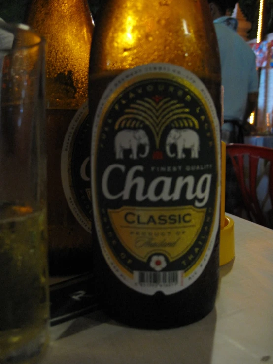 a close up of a bottle of beer on a table