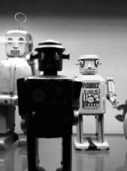 a black and white po with three robots