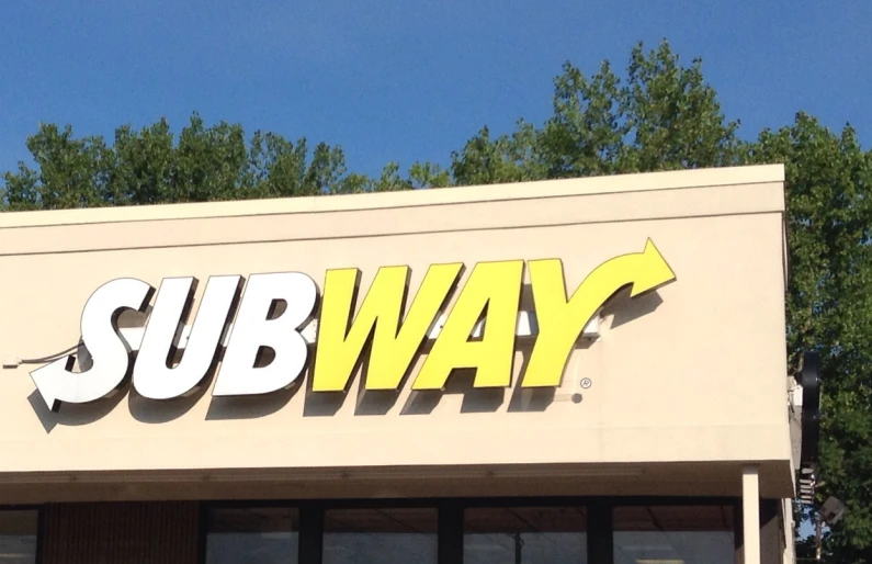 a subway building is shown with the sign subway