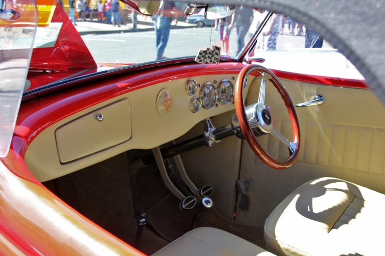 inside the interior of a car with steering wheel showing