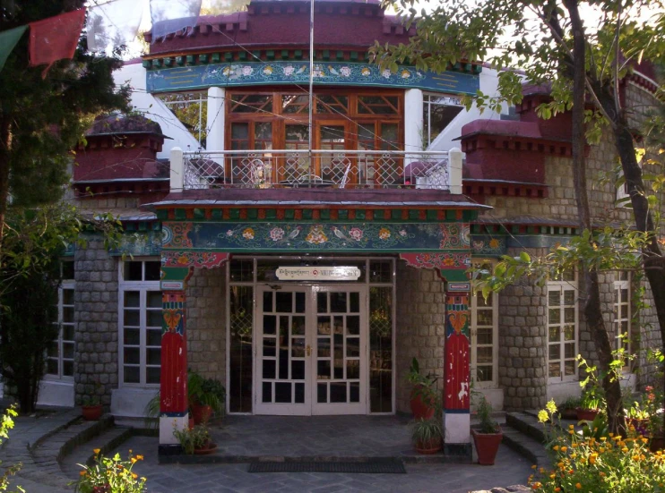 the facade of a building with windows that are decorated with flowers