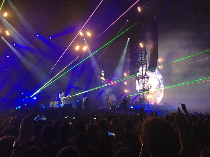 an image of concert scene that has been s using cell phones