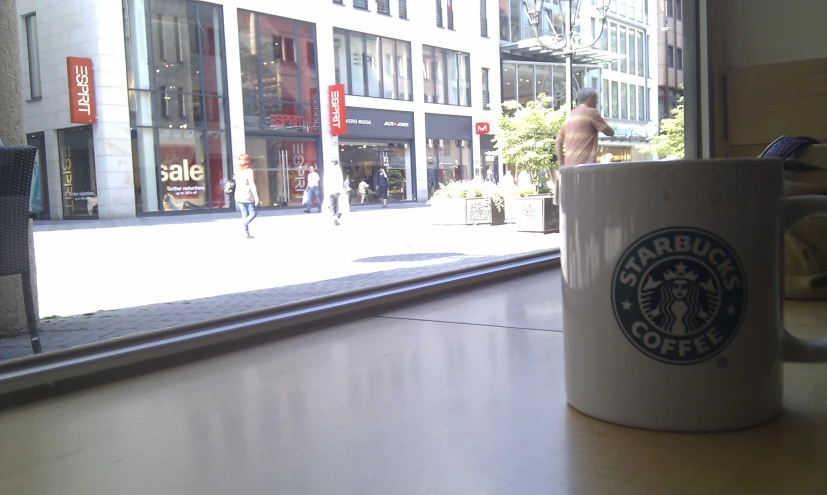 a coffee cup that is on a table