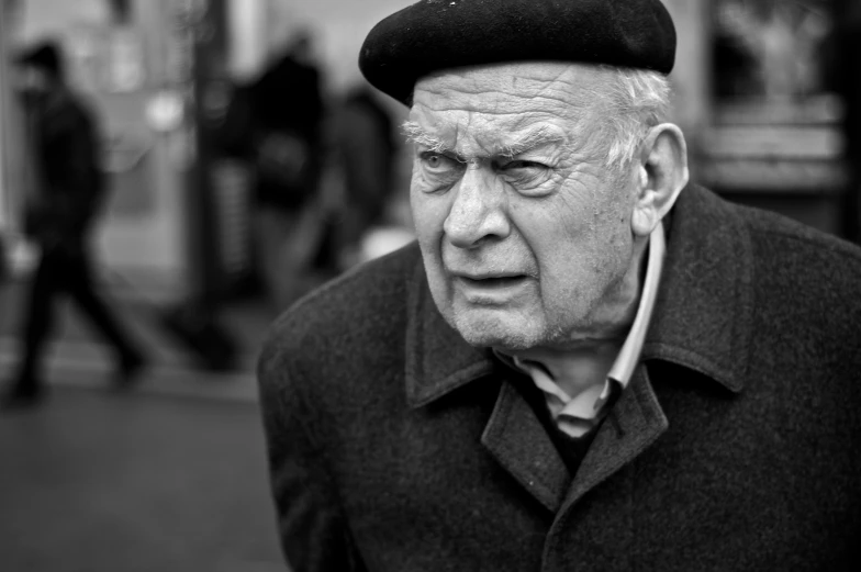 black and white pograph of an old man in winter clothing