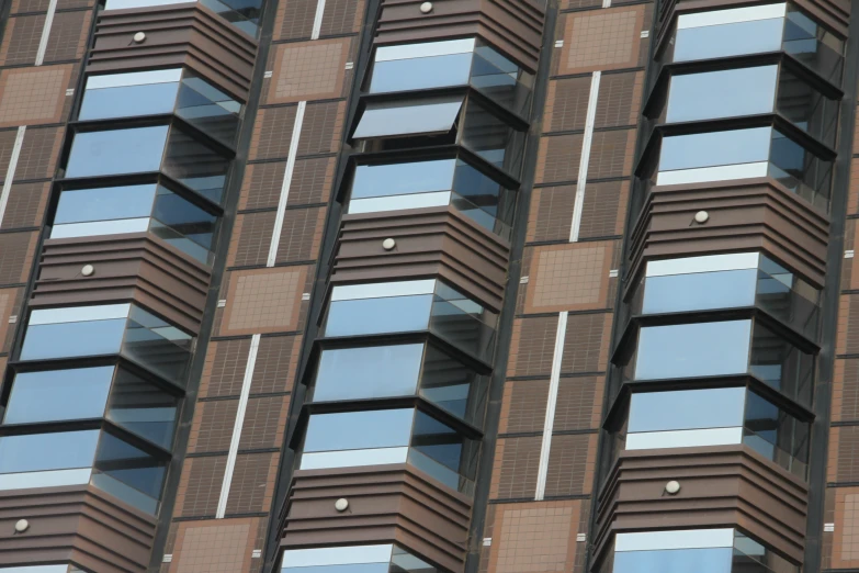 a tall building with lots of windows near by