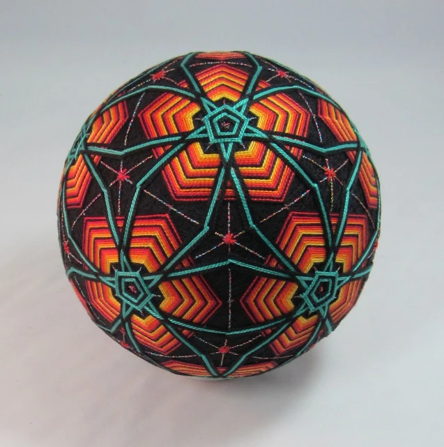 the large ball has colorful, unusual designs on it
