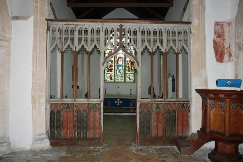 a large wooden and glass door with wrought iron window frames