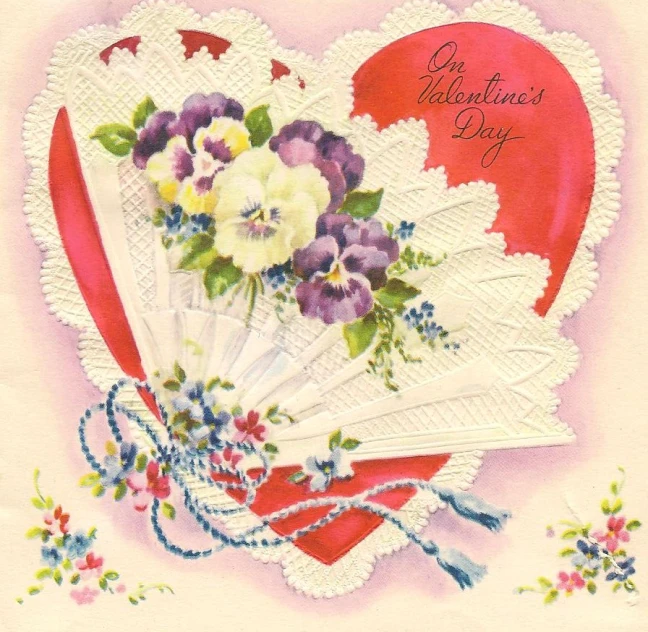 a red heart with white doily holding purple and white flowers