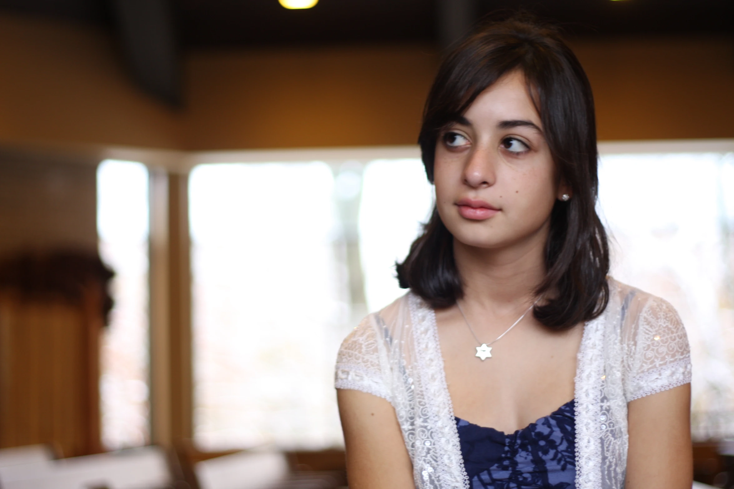 a young woman is staring into the camera