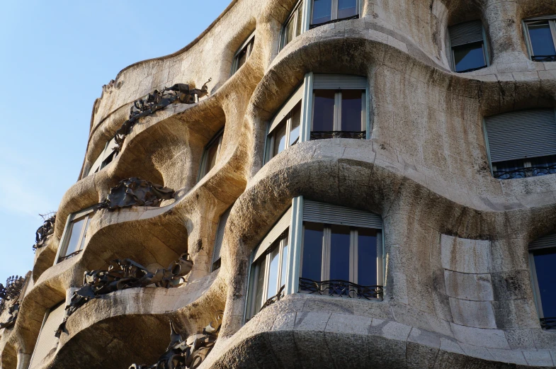 very strange looking building with balconies and windows