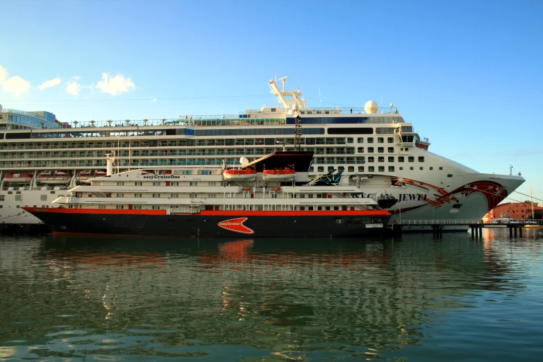 two large cruise ships are parked in the water