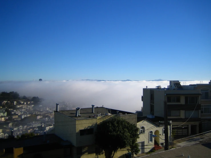 a cloud in the sky above some buildings