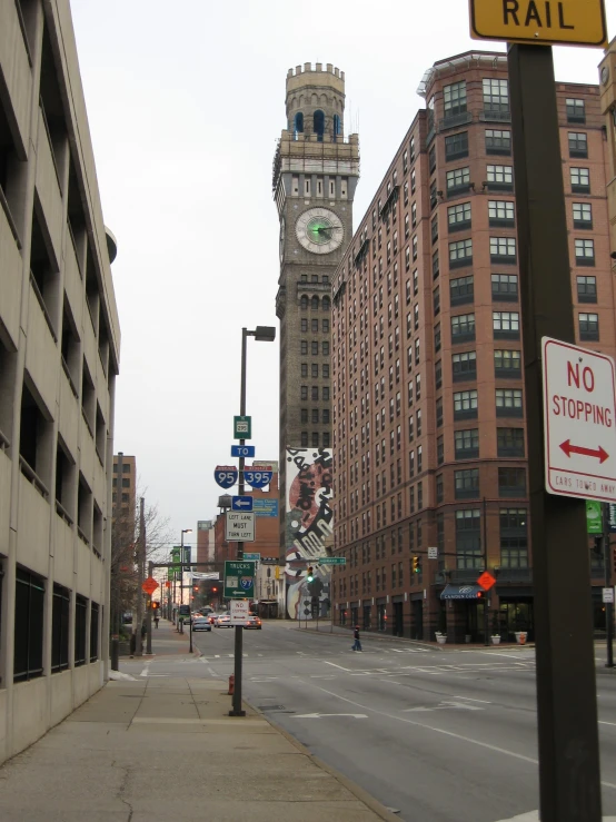 a clock tower in the middle of the city