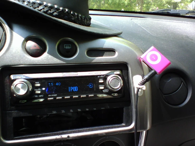 car radio, ipod and ear buds in vehicle