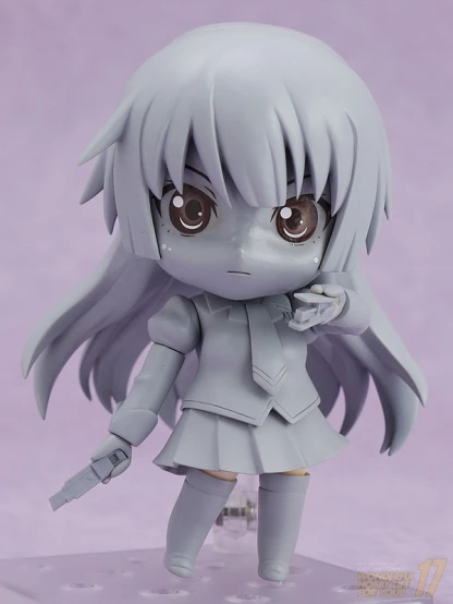 a grey anime girl toy on purple background