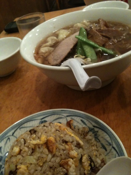 a bowl and a plate that has some food in it