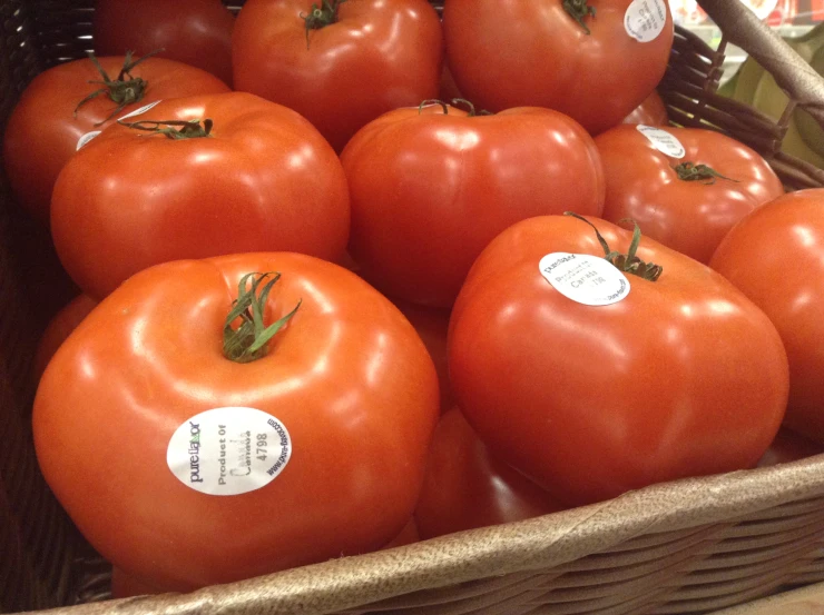 several bunches of tomatoes in a basket