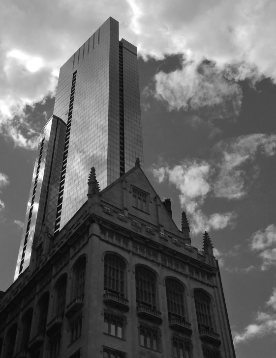 the reflection of buildings in the windows is seen through the clouds