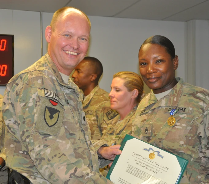 several soldiers with certificates and a woman