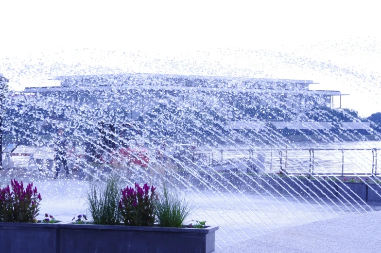 a fountain features water as it blows