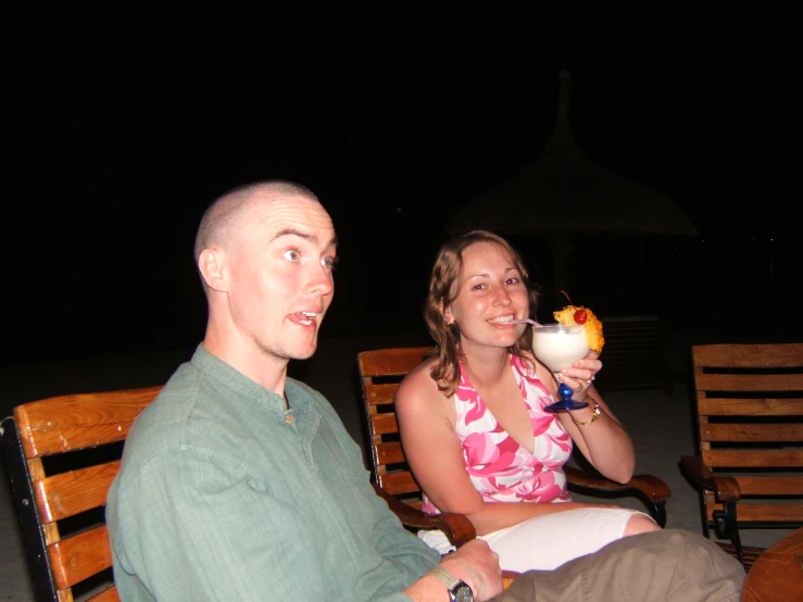 a man and a woman drinking martinis in a el