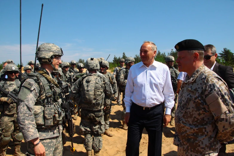 a group of soldiers talking to a soldier