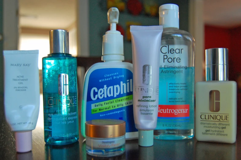 a variety of skin care products sit on a counter