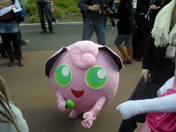 a group of people dressed in costumes with some talking to each other