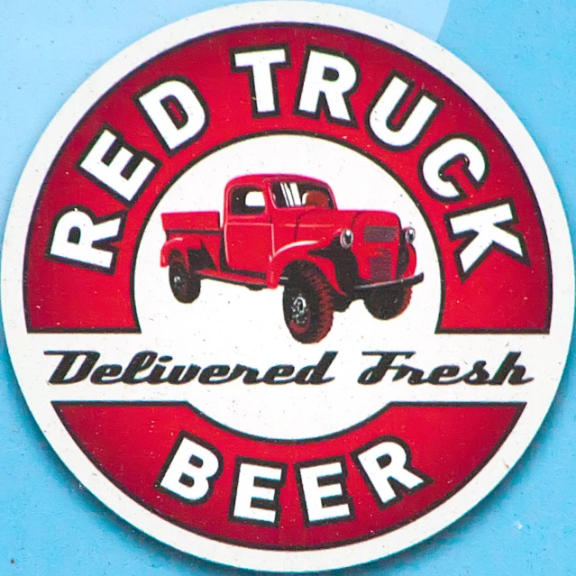 the red truck logo for the beverage is painted on a wall
