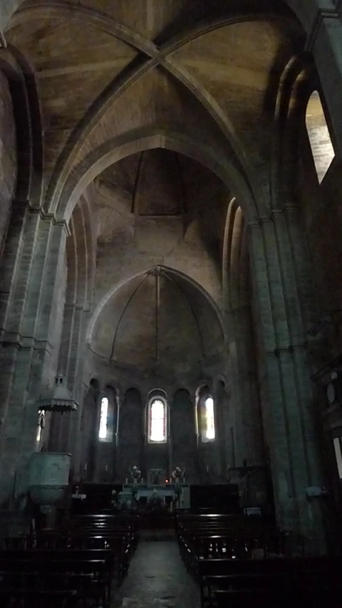 inside an old church with stained glass windows