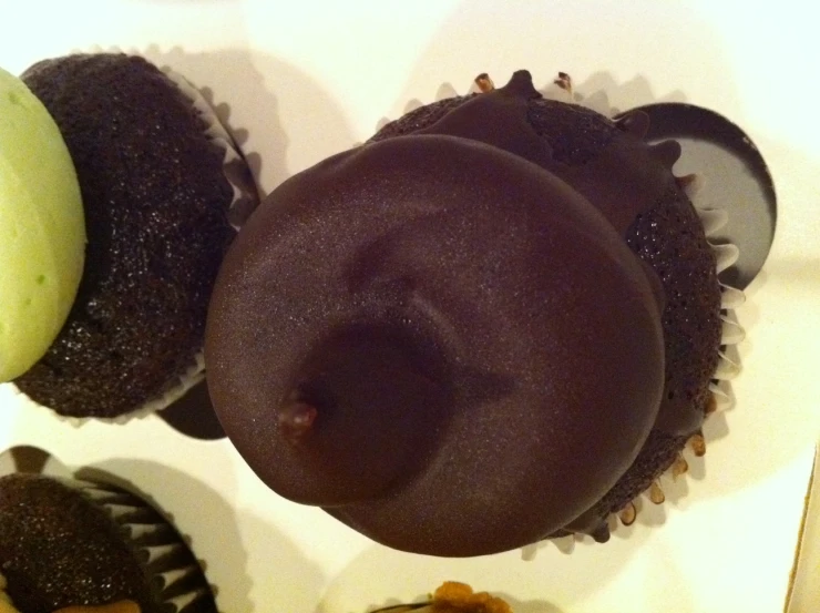 an assortment of different flavored donuts are placed in a box