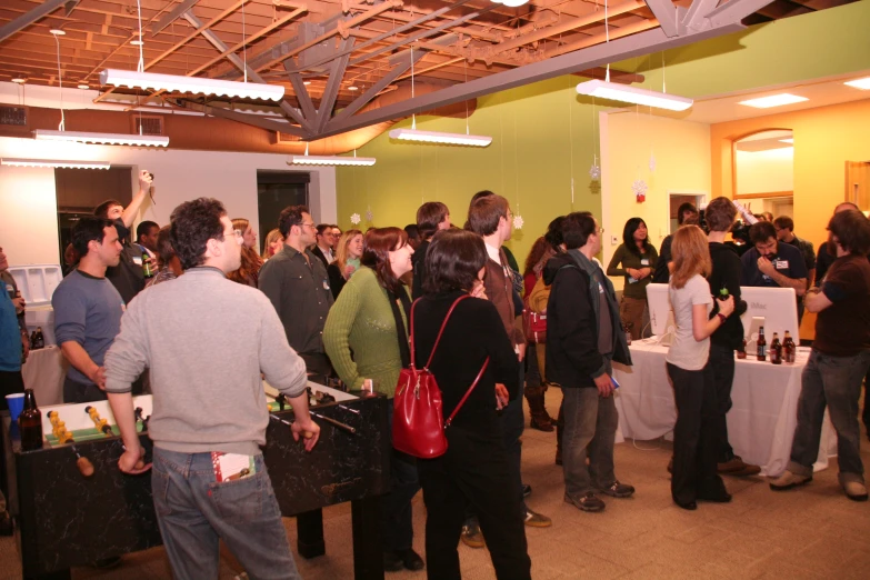 a group of people stand in line to be attended by speakers