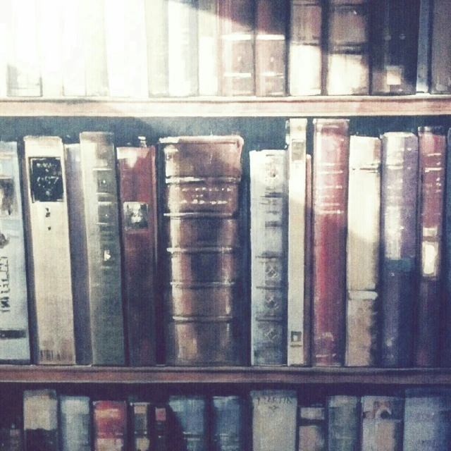 several stacks of bookcases in an old liry
