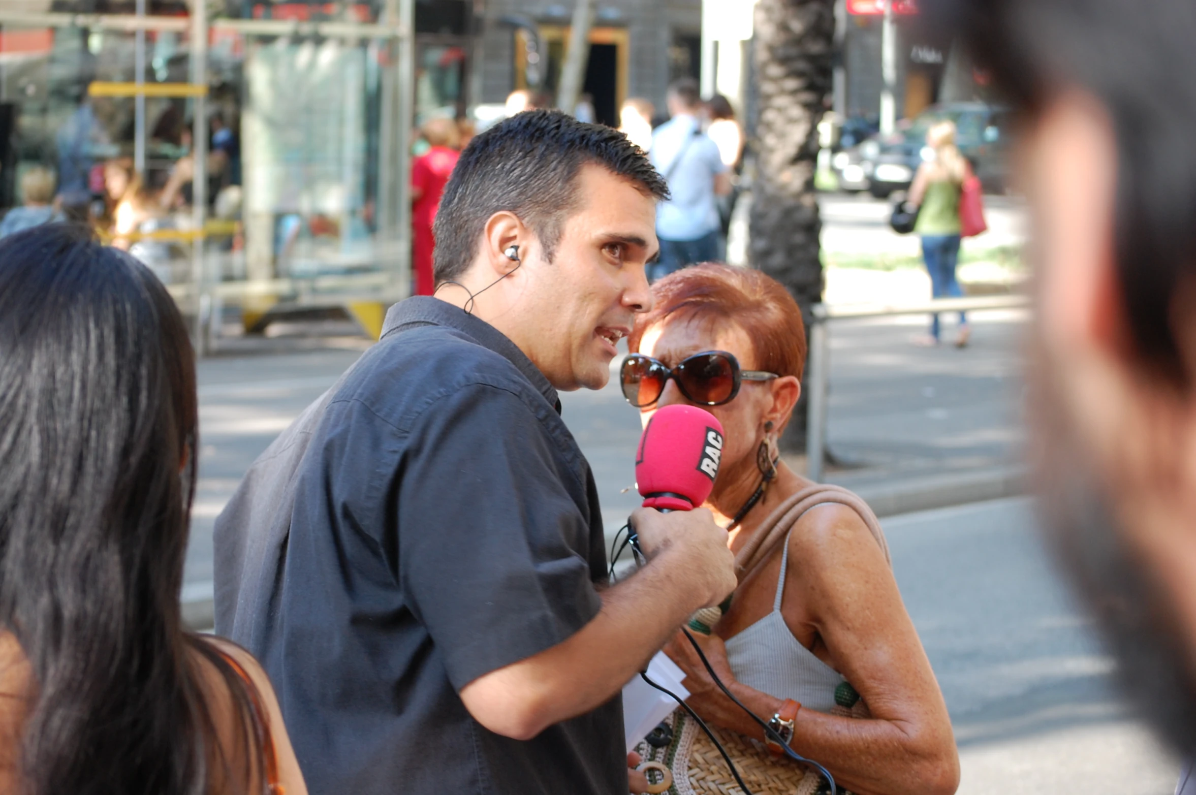 people talking and having a conversation on the street