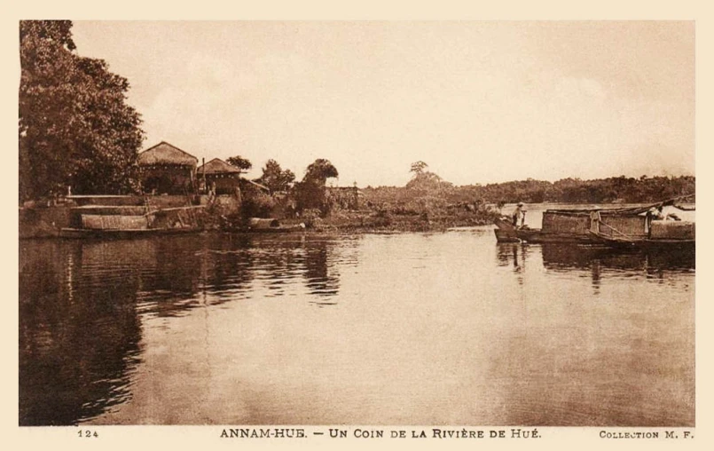 an old image of a river with two boats