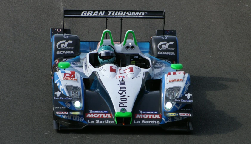 a racing car on the road during the day