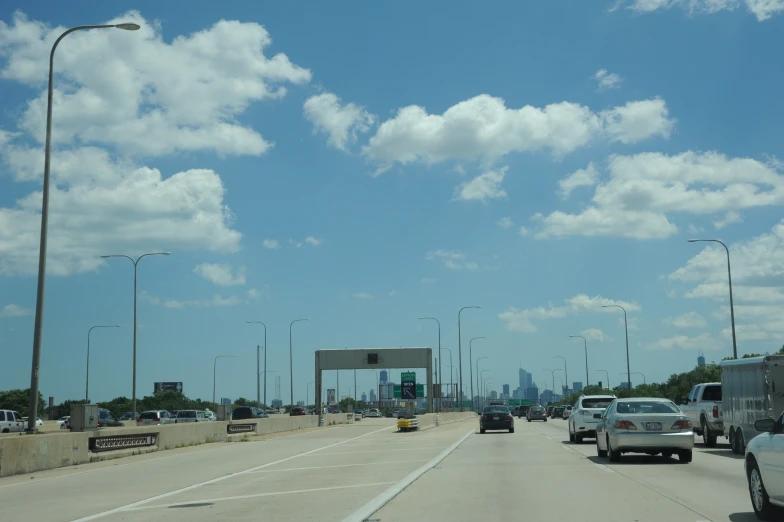 an empty freeway with cars and trucks going down it