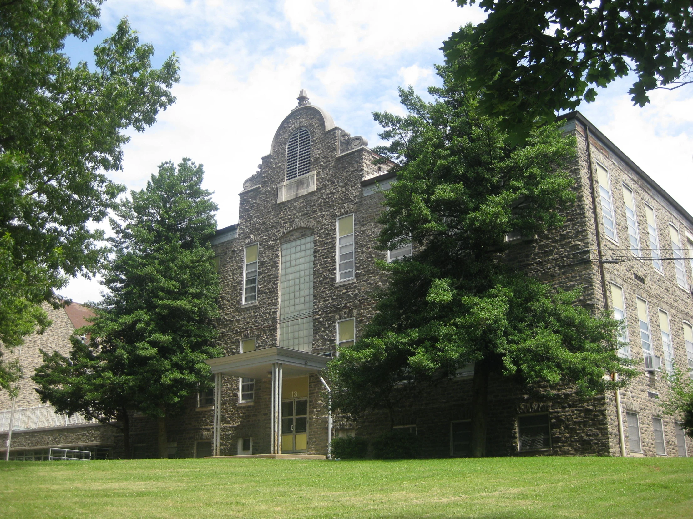 an old stone building has a tall tower