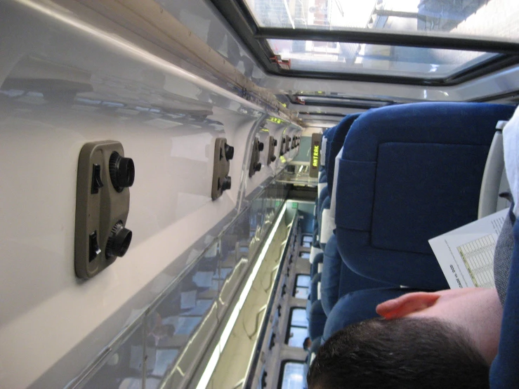 a passenger compartment on a bus that looks to be empty