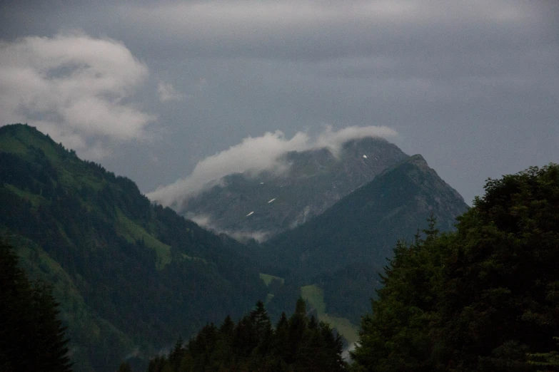 a view of the mountains from a car driving on a road