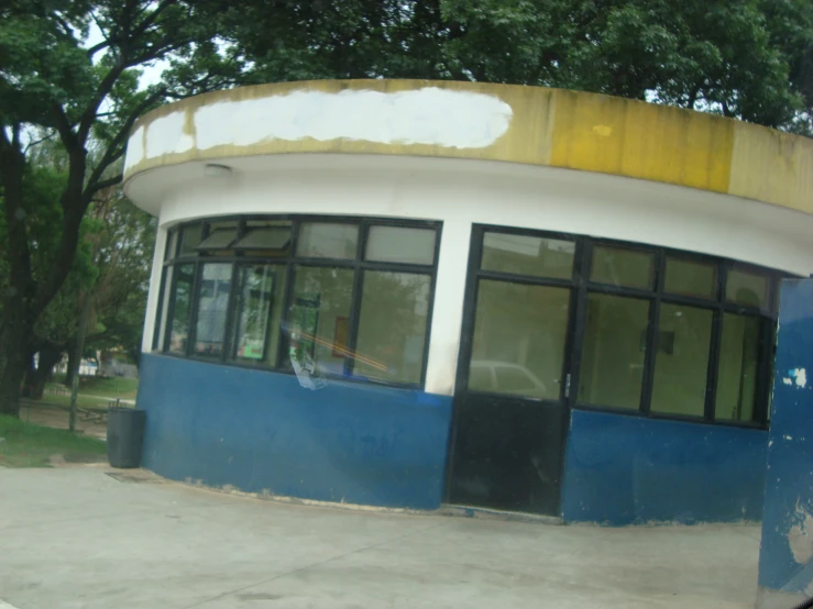 a small circular building with lots of windows