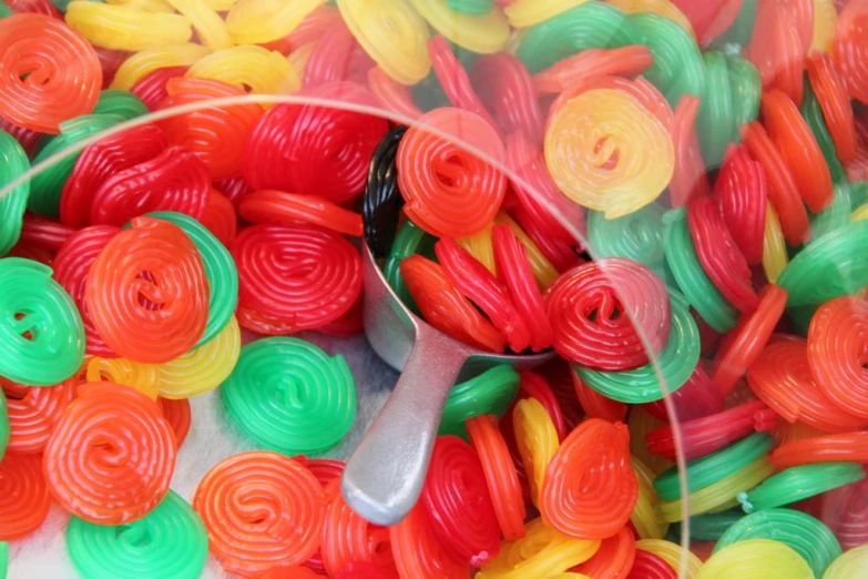 a large bunch of colorful thread, sitting inside a plastic tub