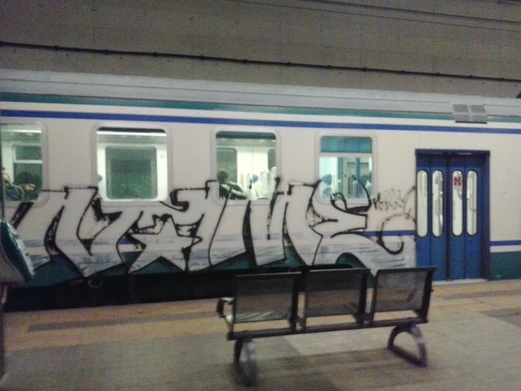 graffiti spray painted on the side of a train
