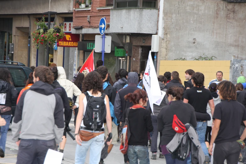 there are many people walking on a street