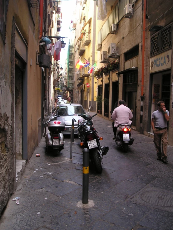 a street scene with two motorcycles and some cars