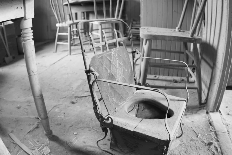 chairs sit on the floor near the toilets