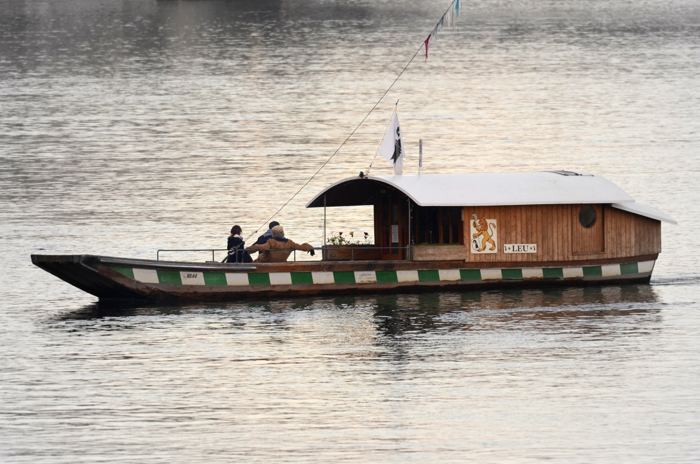 a group of people riding on the back of a boat