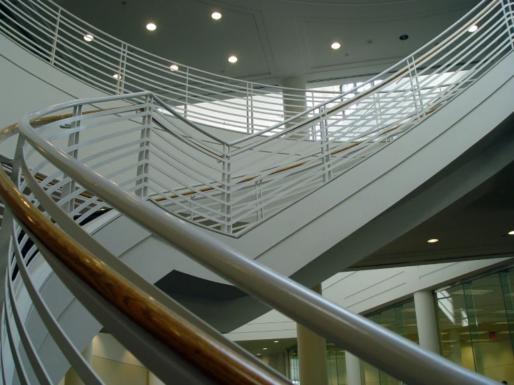 a large spiral staircase with metal rails