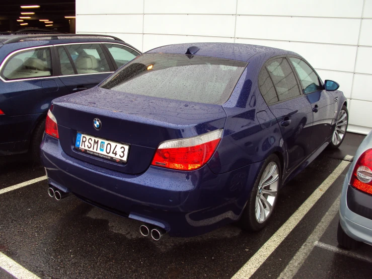 a blue car is parked in a parking space